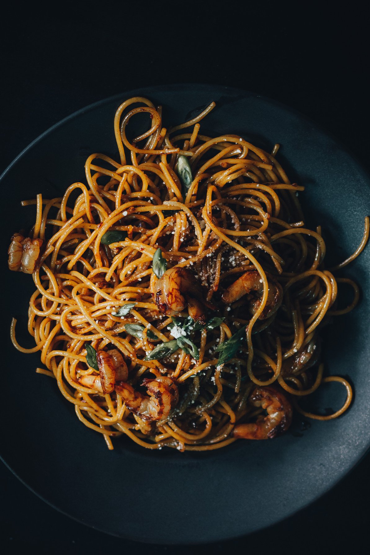 Noodle Dish with Shrimps on Black Plate